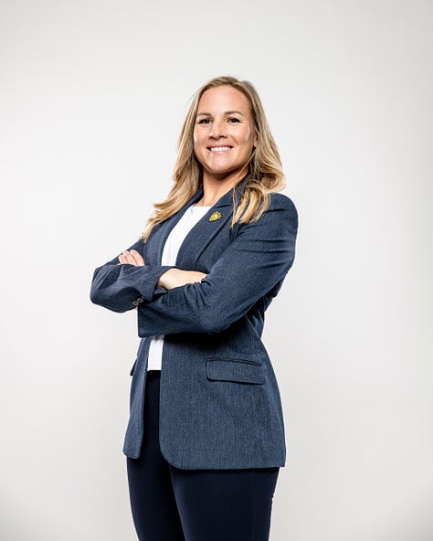 Amy Rodriguez poses for photos at America First Field upon being introduced as the new head coach of the relaunched Utah Royals FC. (Photo: Laura Dearden, Utah Royals FC)