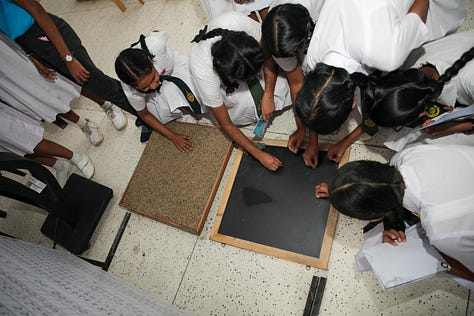 Children and Adults enjoying the Travelling History Museum's Exhibits 