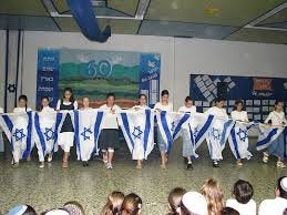 Left: Bnei Akiva girls dancing with Israeli flags; center: Ethiopian-Israeli girls dancing; right: 3 boys playing trumpet