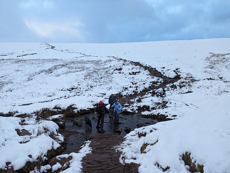 Sunset walk on Pen y Fan in winter with snow 