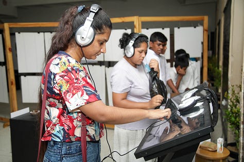 Children and Adults enjoying the Travelling History Museum's Exhibits 