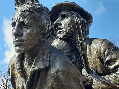 Different angles close up of the North Carolina monument on the Gettysburg battlefield showing the faces of the soldiers facing the battlefield.