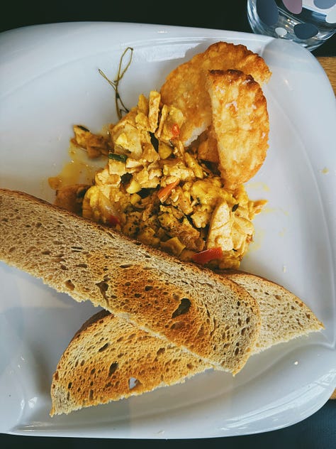 three images of vegan, jamaican cuisine, showcasing ackee, roti, rice and peas, and palm hearts.