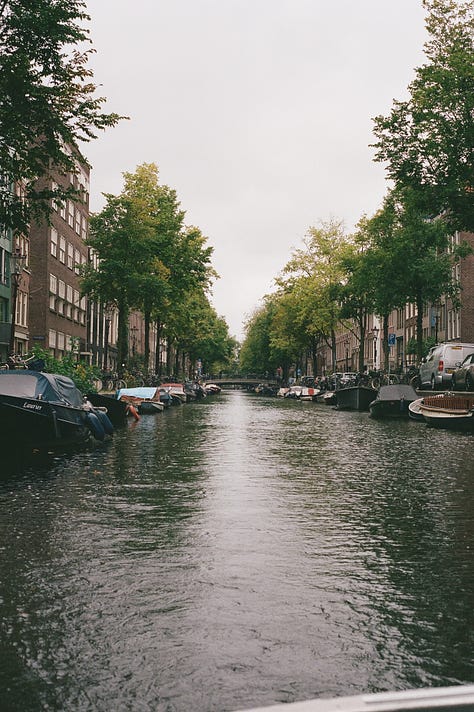 boats on a canal, woman in boat