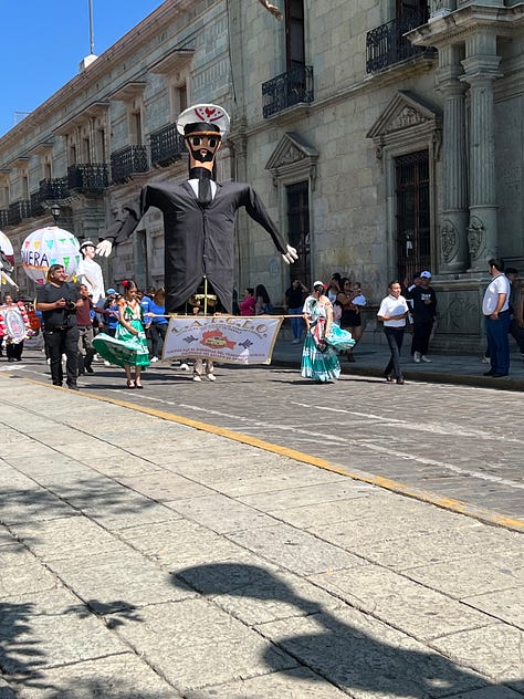 Three photos showing taxis in Oaxaca with flowers on their hoods, and a large effigy of a taxi driver wearing a captain's hat.