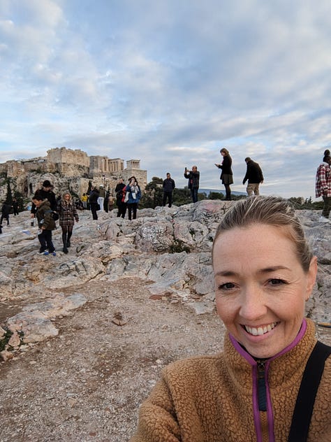 View of the Acropolis, author on Mars Hill, and a dog by Greek ruins