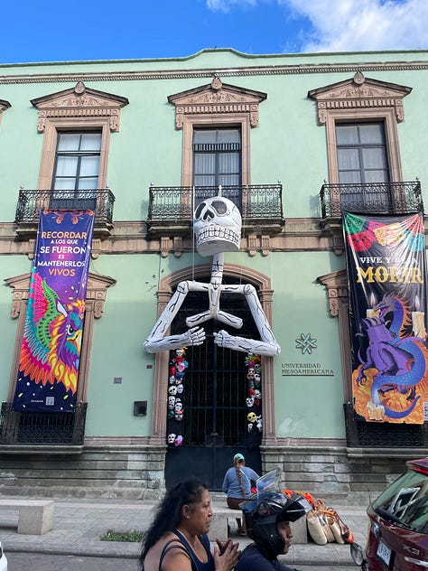 A nine image collage showing elaborate Día de Muertos decorations in the city.