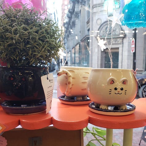 Kitty shaped mugs from different angles.