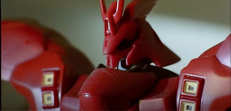 A collection of screenshots from the Somewhere I Belong music video featuring several small plastic models from different Gundam series.