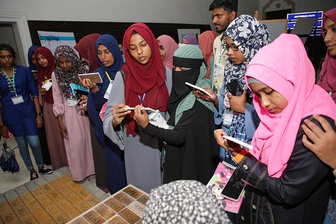 Children and Adults enjoying the Travelling History Museum's Exhibits 