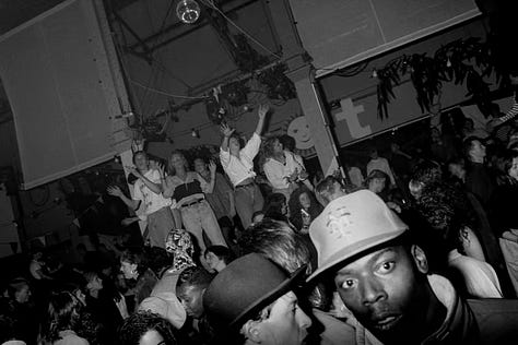 A nightclub and people dancing and partying
