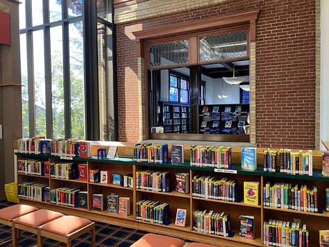 Library photos showing books, computers, and the author