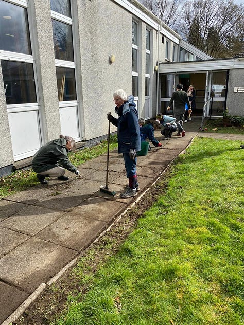 Volunteers working outside the village hall