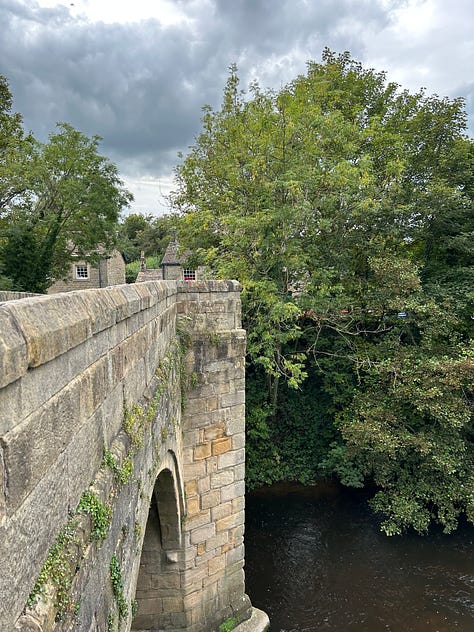 5 photos. The River Derwent flowing through Baslow, Derbyshire. The old bridge which crosses the River Derwent. Note the toll house. In the distance is the weir of the old flour mill. Images: Roland's Travels