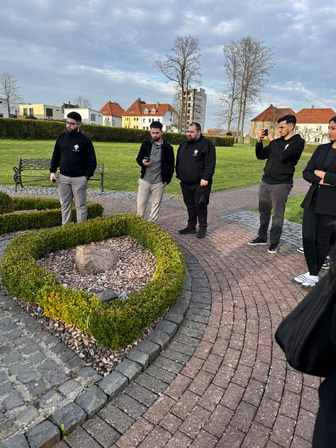 People looking at a monastery