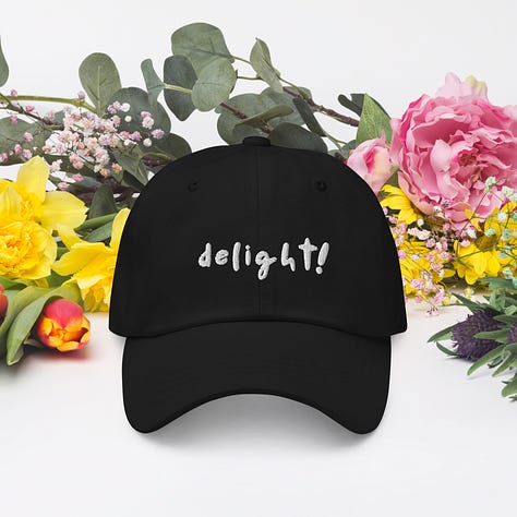 hat, mug, and tote with the caption "delight!"