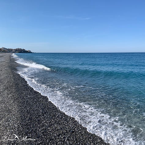 Images of the Mediterranean with its blue nuances. In the middle a white flower with the ocean as backdrop