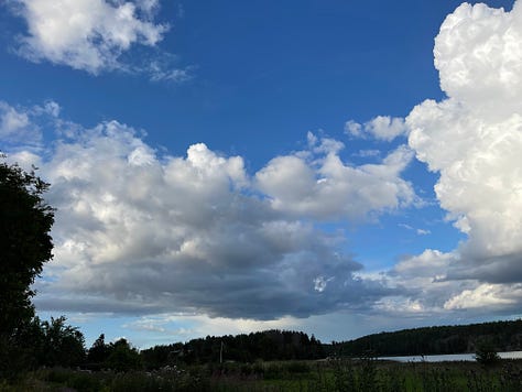Three photos of fluffy white clouds hanging in the sky