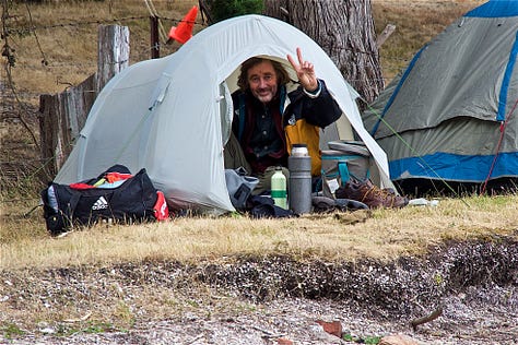 camping on Quarantine Bay, showing tents and people on top of a midden