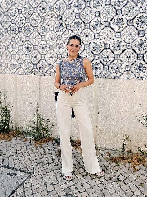 Photos of blue and white tiles, orange rooftops, and cathedral cloisters in Portugal, with a young white man and woman in frame