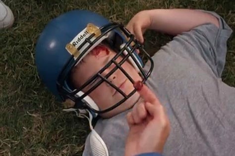 A child who looks like he’s bleeding after a football tackle in Little Giants 1994 actually just had a PB&J sandwich tucked into his helmet