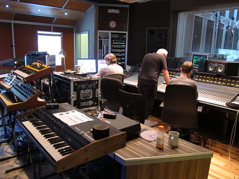 Inside a recording studio with lots of analog synthesisers. James Mottershead, Mark Cleator and Simon Campbell