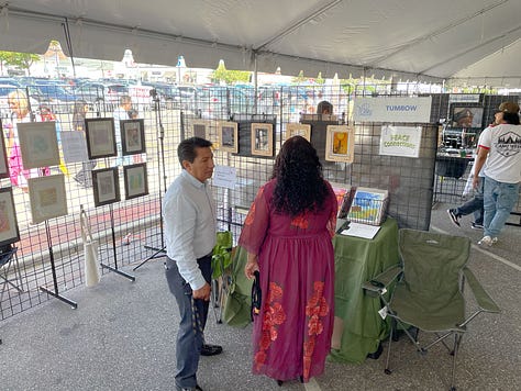 visitors in the booth of Peace Connection 