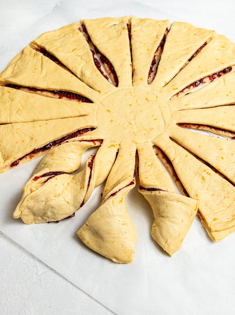 Making cranberry orange star bread.