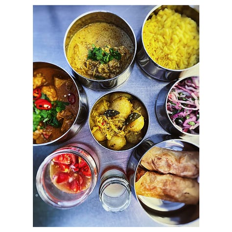 A selection of many dishes of food