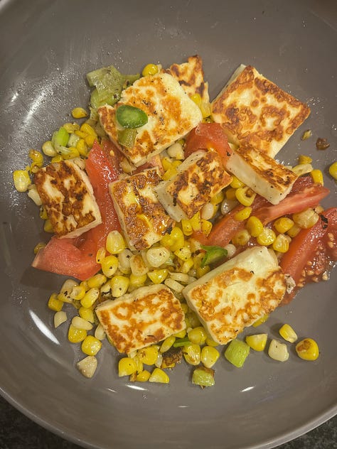 three pictures of food, one of a big green salad, one of grilled corn and cheese, and one of a mac and cheese