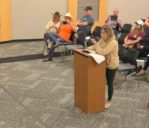 A parent demands district superintendent Theresa Williams look at her while she complains about books in Plano ISD