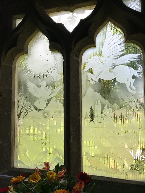 Lewis' grave and the Narnian window at Holy Trinity Church, Headington, UK