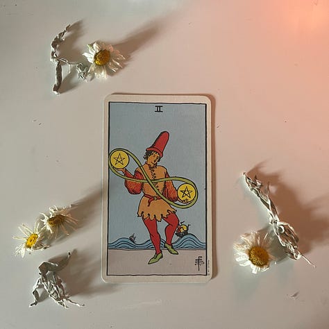 Varies depictions of the Two of Pentacles Tarot card