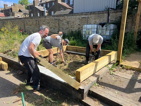 A team of volunteers build a large pond
