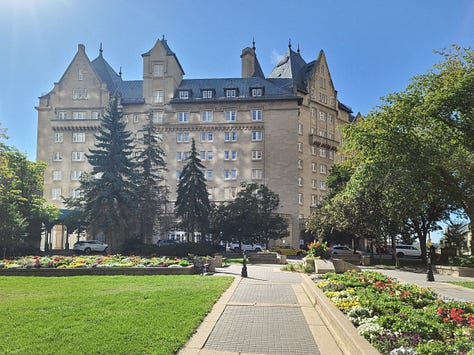 Pink greatest hits play list to get in concert mood, Coming into Edmonton with a view of the downtown, Crossing the bridge in Edmonton with views of the Fairmont Hotel in the distance, A Samsung phone shot of the Fairmont Hotel Edmonton AB.  Sunshine shines through the windows in a hallway of the Fairmont Hotel Edmonton. A side entrance of the Hotel Fairmont Macdonald, in Edmonton.  