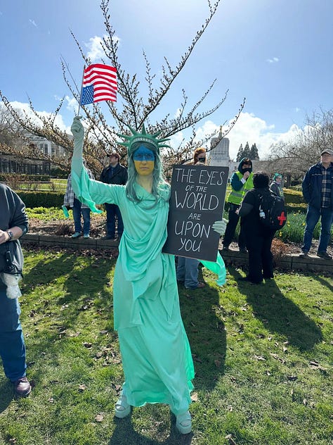 Several photos of protesters around the country with signs opposing the Trump administration and Elon Musk