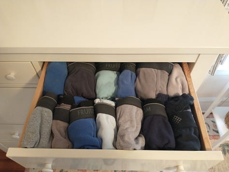 Shirs, hats, sweatshirts and yes, even underwear, arranged in color-coordinated rows in drawers and on hangers.