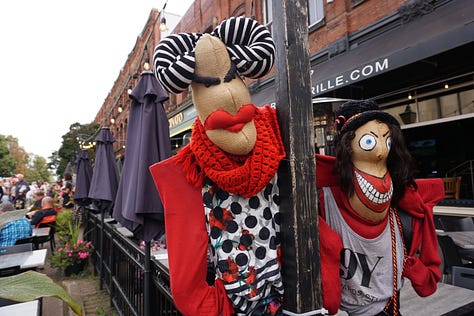Scarecrows wear old clothing, colourful accessories, and funny expressions on their faces as they stand propped up against lampposts and other landmarks in Charlottetown.