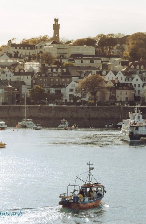 The picturesque capital city of Guernsey, St Peter Port: entrance, the city church, the colorful streets shrouded in mist. Photos by Peter Tiffin