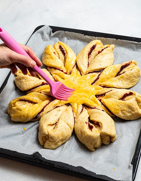 Making cranberry orange star bread.