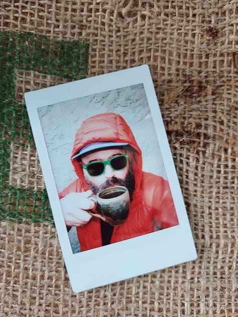 Instant photographs of coffee mugs or a bearded man drinking coffee.