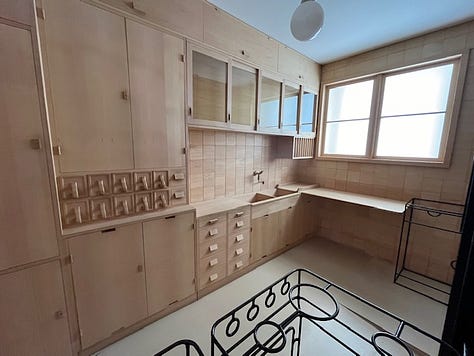 Images of a kitchen made of wood to demonstrate the iconic Frankfurt kitchen on the late 1920s. 