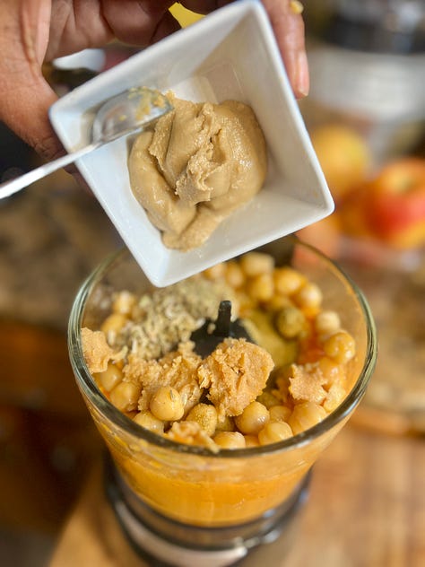 Sweet potato hummus with pita chips and chickpeas and sweet potato in a food processor