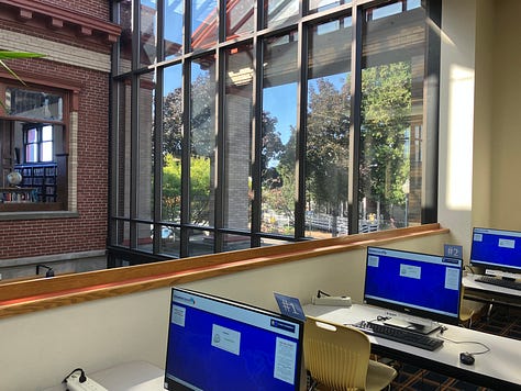 Library photos showing books, computers, and the author