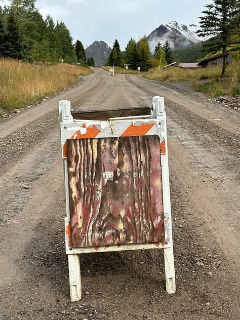 various handmade signs telling you to slow down