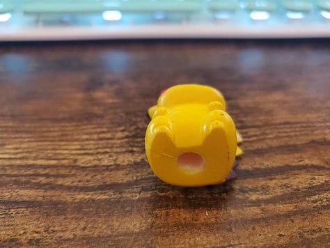 A selection of photographs from Shayne Roberts of his Pikachu Pencil Topper, and framed shirt