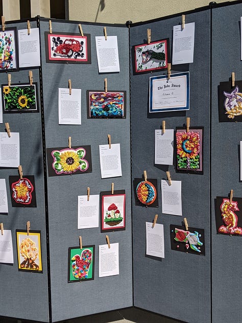 images of paper quilling, word art, and a colorful drawing showing a doctor holding up the world from the top of a large coronavirus