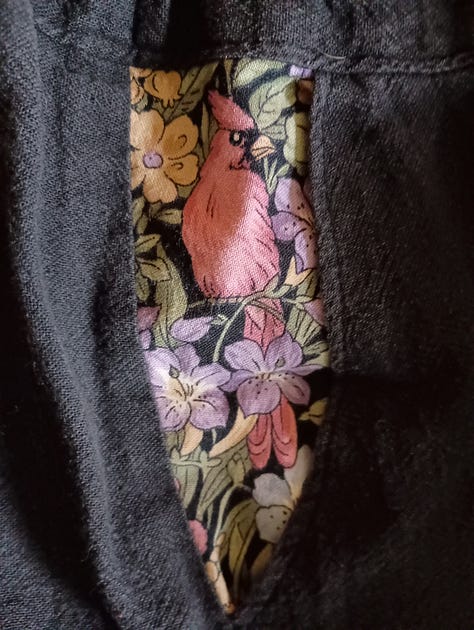 Two images of fabric with birds on flowers and a shot of a man wearing a full black linen set.