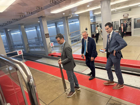 Sen. Tommy Tuberville catches Senate tram.