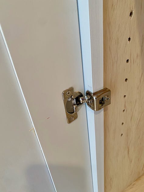 Adding Euro hidden hinges to cabinet doors.